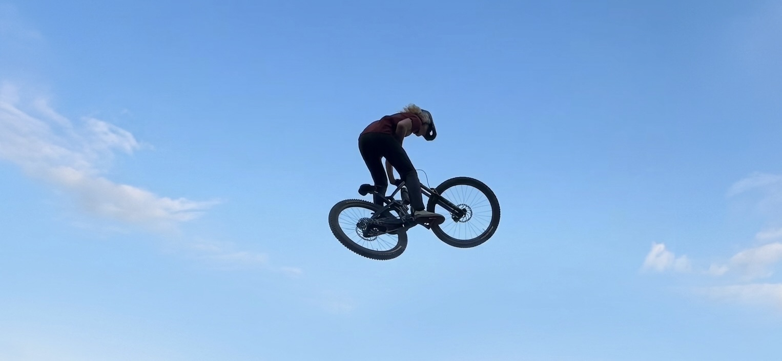 Photo: a wide riding shot — you, the trail, the bike. Sets scene.